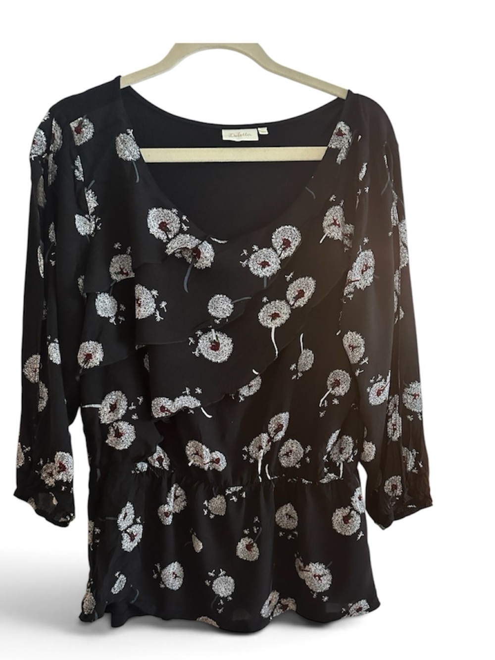 Deletta Black Floral Ruffle V-Neck Blouse with open sleeves.